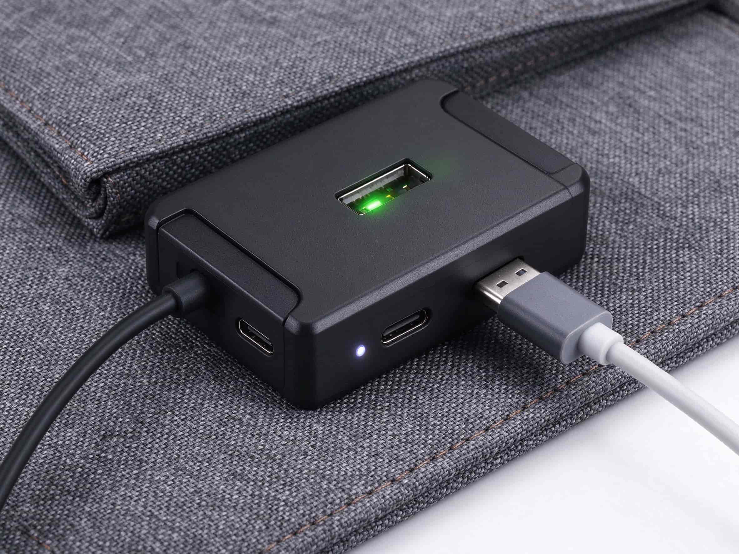 Close-up of USB output, Type-C input, and LED indicator on solar charger